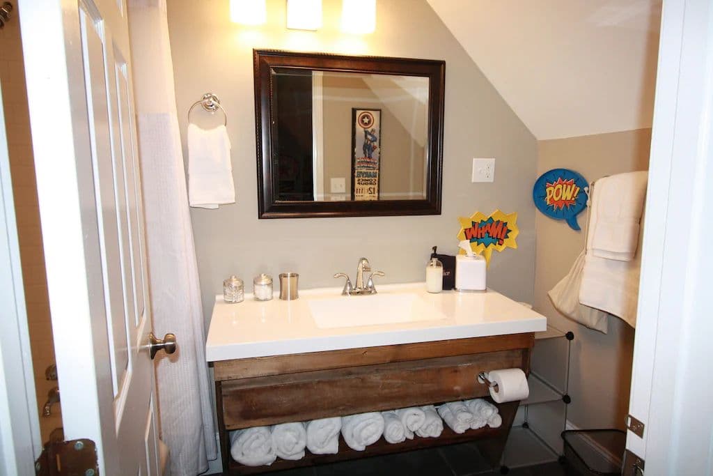 The Den Bathroom - Sink, Shower/Bath, Toilet.