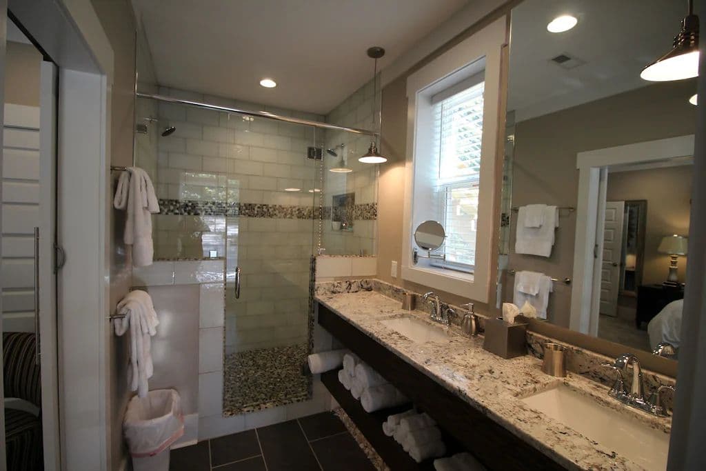 Downstairs Jr. Mater EnSuite Bathroom - Double Vanity, Double Headed Shower, & A Toilet.