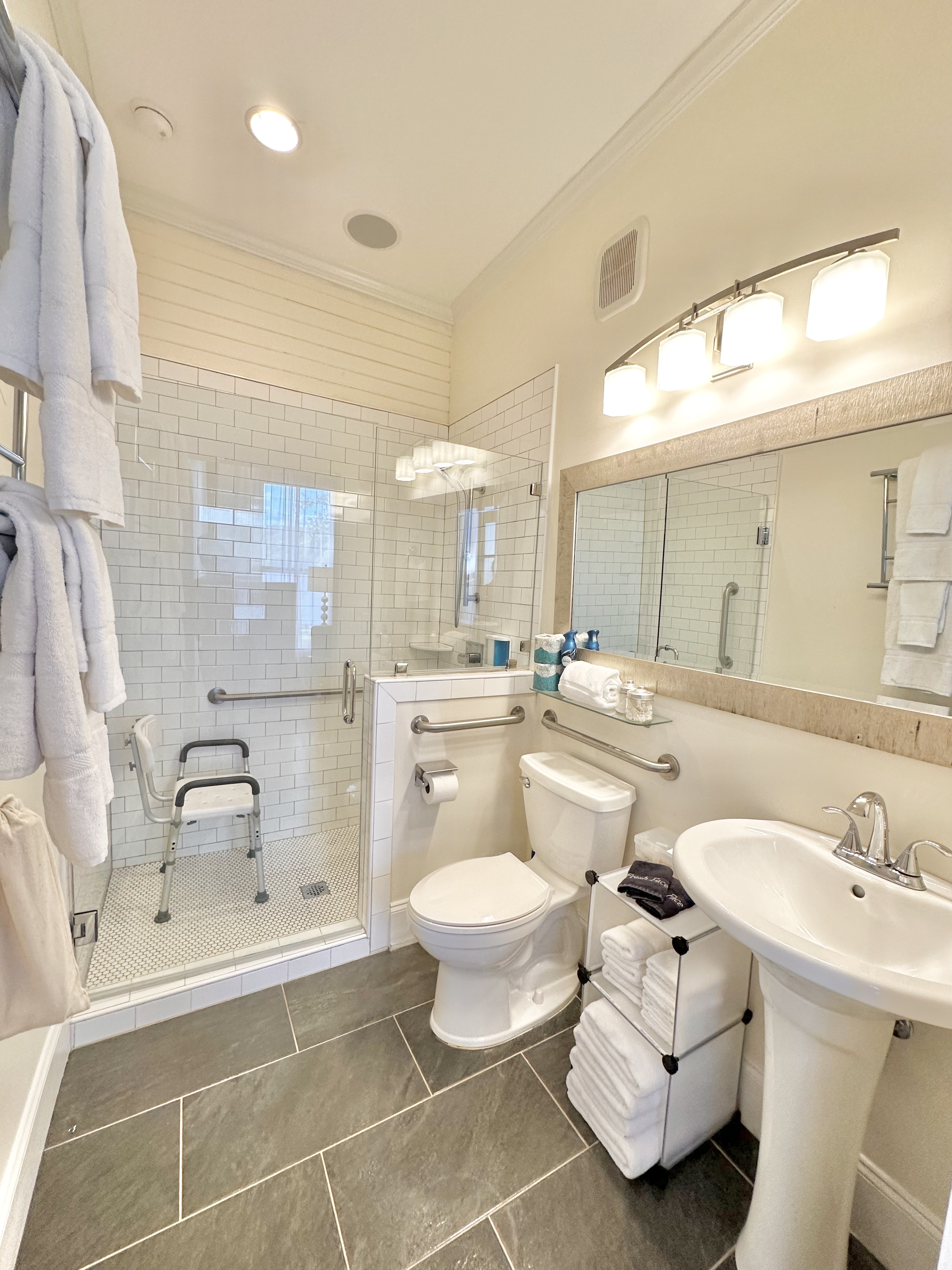 The Brown Room enSuite-Main Level. Wide door, ADA shower chair, and hand rails.