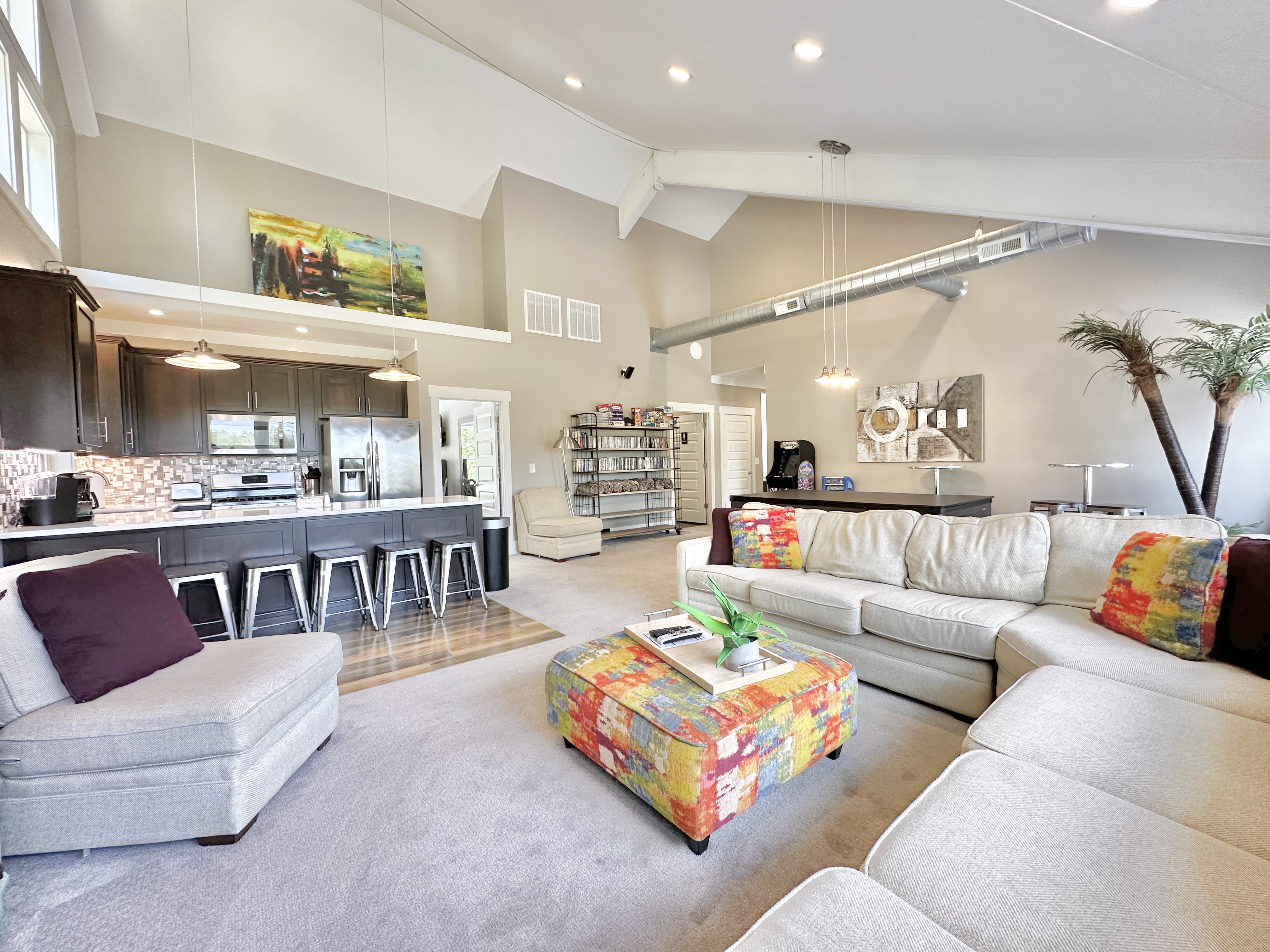 Upstairs family room w/ second kitchen, pool, ping pong, games, & tons of DVD’s